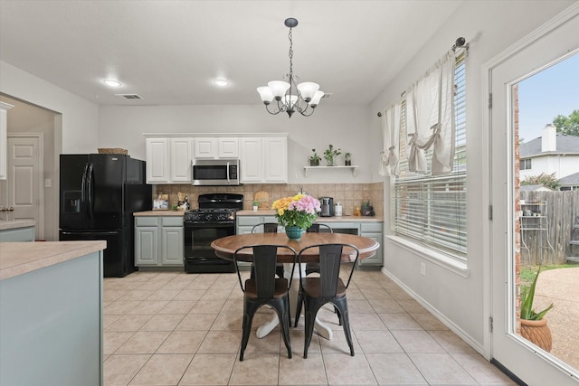 5305 Elmdale Dr, Watauga, TX 76137 - dining area featuring a chandelier, light tile patterned floors, and recessed lighting