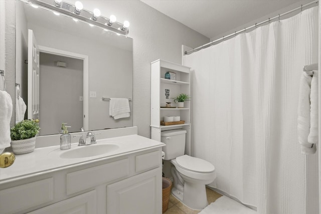 5305 Elmdale Dr, Watauga, TX 76137 - full bath featuring toilet, vanity, and tile patterned floors