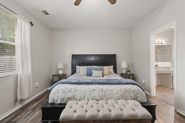 5305 Elmdale Dr, Watauga, TX 76137 - bedroom featuring wood finished floors, multiple windows, and baseboards