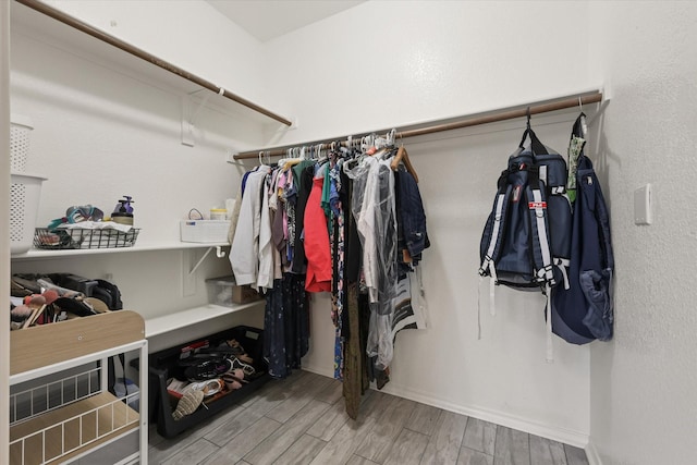 5305 Elmdale Dr, Watauga, TX 76137 - spacious closet featuring wood finished floors