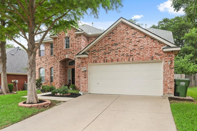5305 Elmdale Dr, Watauga, TX 76137 - view of front of home with concrete driveway, brick siding, an attached garage, and roof with shingles