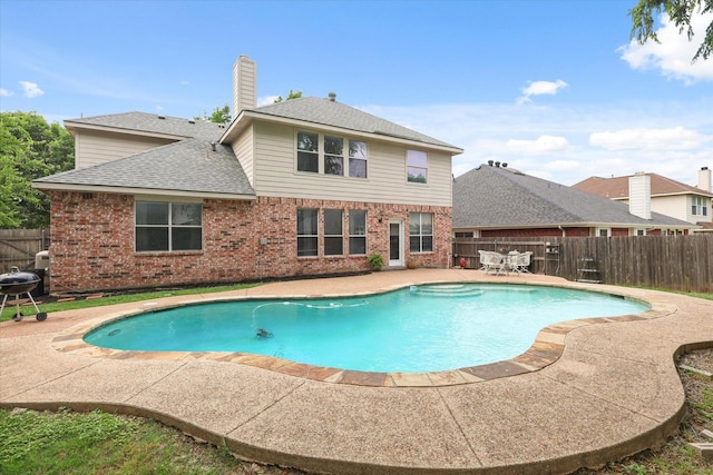 5305 Elmdale Dr, Watauga, TX 76137 - view of swimming pool featuring a patio and a fenced backyard