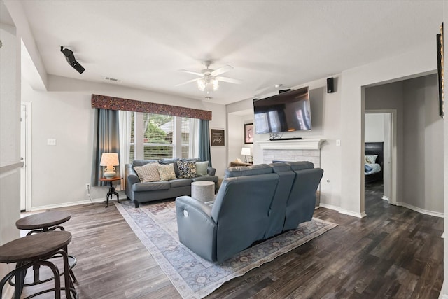 5305 Elmdale Dr, Watauga, TX 76137 - living room with a ceiling fan, wood finished floors, a fireplace, and baseboards