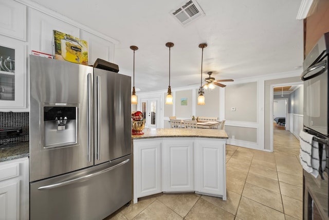 5005 Nevada Trl, North Richland Hills, TX 76180 - kitchen featuring stainless steel refrigerator with ice dispenser, white cabinets, a peninsula, tasteful backsplash, and a ceiling fan