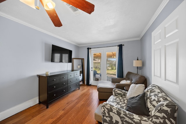 5005 Nevada Trl, North Richland Hills, TX 76180 - living room featuring ceiling fan, wood finished floors, crown molding, and baseboards