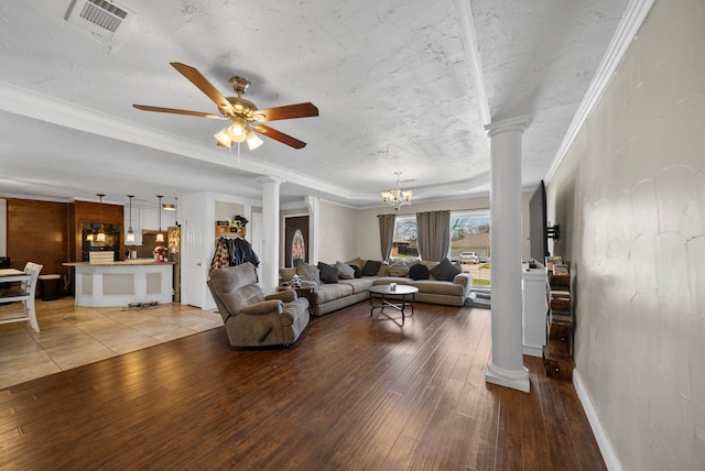 5005 Nevada Trl, North Richland Hills, TX 76180 - living area featuring decorative columns, light wood-style flooring, ornamental molding, a chandelier, and a ceiling fan