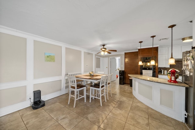 5005 Nevada Trl, North Richland Hills, TX 76180 - dining area featuring a ceiling fan, crown molding, and light tile patterned flooring