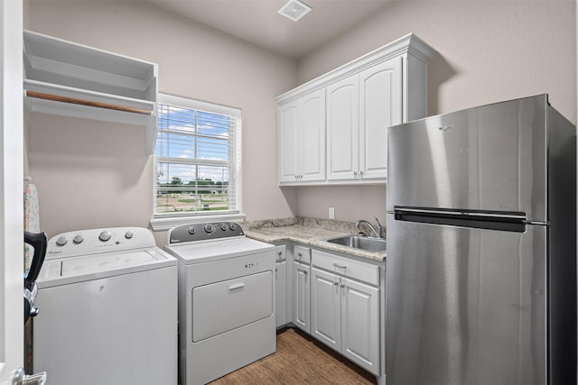 1103 Hilkiah Ct, Granbury, TX 76048 - laundry room featuring wood finished floors and washing machine and dryer