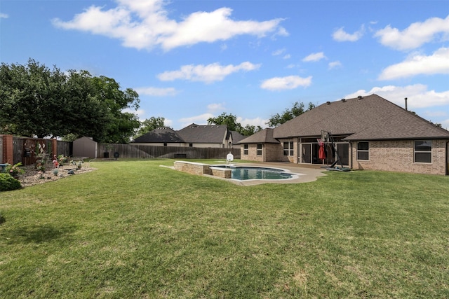1103 Hilkiah Ct, Granbury, TX 76048 - view of yard with a pool with connected hot tub and a patio area