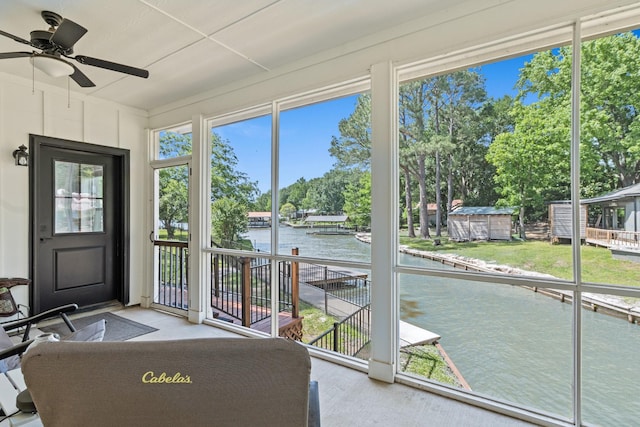 138 Sunset Dr, Gun Barrel City, TX 75156 - unfurnished sunroom with a water view, ceiling fan, and view of wooded area