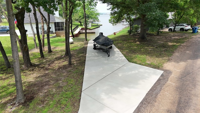 138 Sunset Dr, Gun Barrel City, TX 75156 - view of home's community with a water view and a lawn