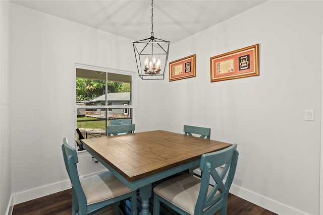 138 Sunset Dr, Gun Barrel City, TX 75156 - dining area with baseboards, a chandelier, and dark wood finished floors