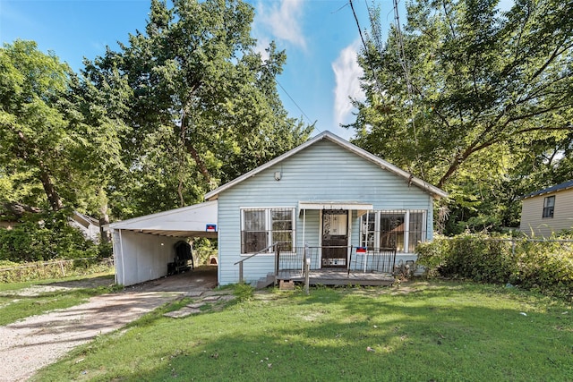 1622 Ave B, Dallas, TX 75203 - bungalow-style home featuring concrete driveway, covered porch, and an attached carport