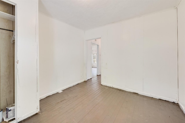 1622 Ave B, Dallas, TX 75203 - unfurnished bedroom with hardwood / wood-style flooring and baseboards