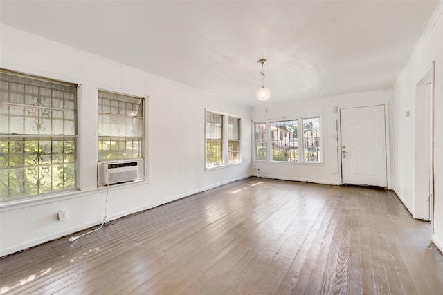 1622 Ave B, Dallas, TX 75203 - unfurnished living room featuring hardwood / wood-style flooring and cooling unit