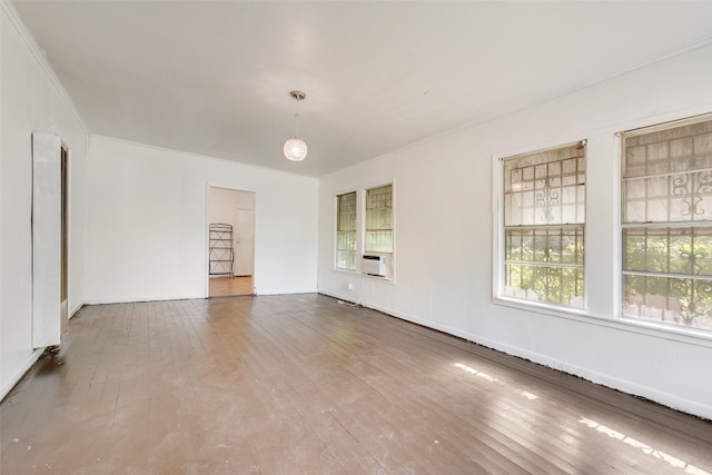 1622 Ave B, Dallas, TX 75203 - unfurnished room featuring hardwood / wood-style flooring, plenty of natural light, and crown molding