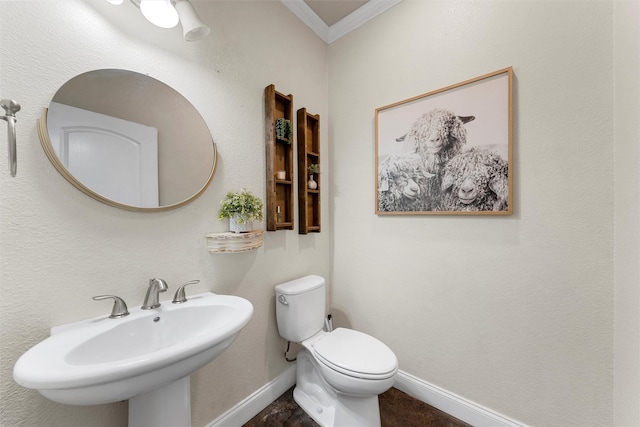 9359 W 5th St, Crawford, TX 76638 - half bathroom featuring crown molding, toilet, a sink, and baseboards