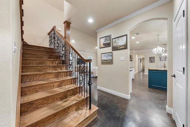 9359 W 5th St, Crawford, TX 76638 - stairway with arched walkways, concrete floors, ornamental molding, recessed lighting, and baseboards