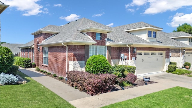 2813 Fordham Rd, Plano, TX 75025 - view of front of property featuring brick siding, an attached garage, driveway, and roof with shingles