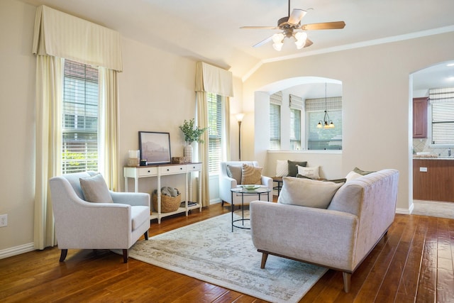 2813 Fordham Rd, Plano, TX 75025 - living room with arched walkways, plenty of natural light, dark wood-type flooring, ceiling fan, and ornamental molding