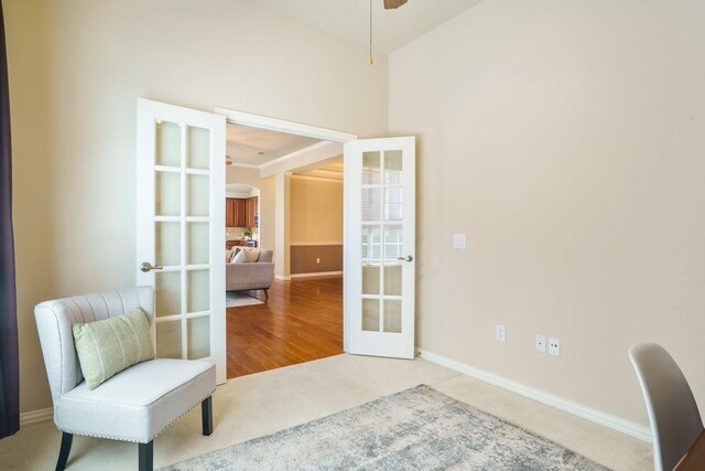 2813 Fordham Rd, Plano, TX 75025 - sitting room with french doors, carpet floors, arched walkways, and baseboards