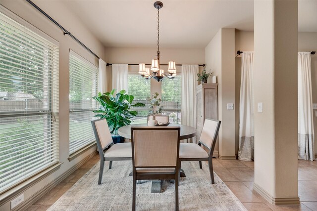 7704 Michael Ct, Mckinney, TX 75071 - dining room with a chandelier, light tile patterned floors, and baseboards
