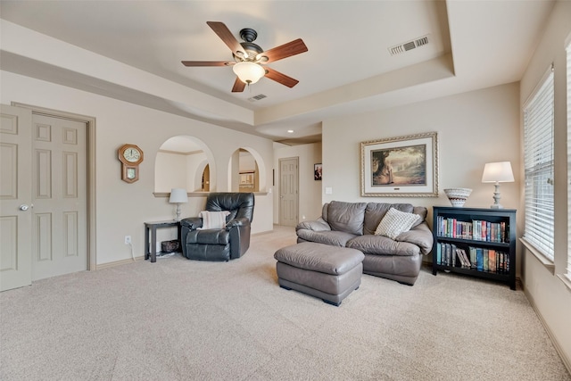 7704 Michael Ct, Mckinney, TX 75071 - carpeted living room with healthy amount of natural light, ceiling fan, a raised ceiling, and baseboards