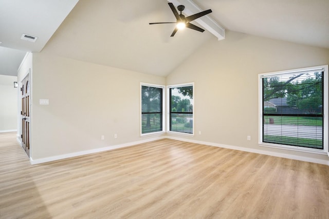 1202 Bayshore Dr, Rockwall, TX 75087 - spare room featuring healthy amount of natural light, beam ceiling, a ceiling fan, light wood-type flooring, and high vaulted ceiling
