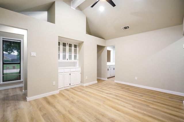 1202 Bayshore Dr, Rockwall, TX 75087 - empty room with ceiling fan, light wood-type flooring, beam ceiling, baseboards, and high vaulted ceiling