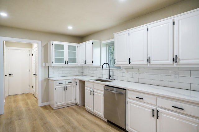 1202 Bayshore Dr, Rockwall, TX 75087 - kitchen with a sink, stainless steel dishwasher, tasteful backsplash, light wood-type flooring, and recessed lighting
