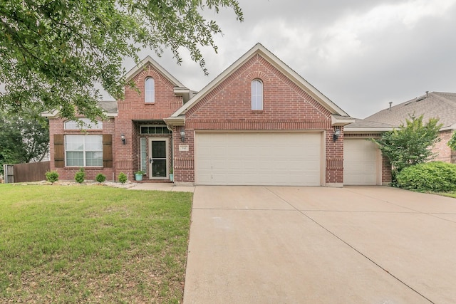 941 Sequoia Way, Saginaw, TX 76131 - traditional home with an attached garage, concrete driveway, brick siding, and a front lawn