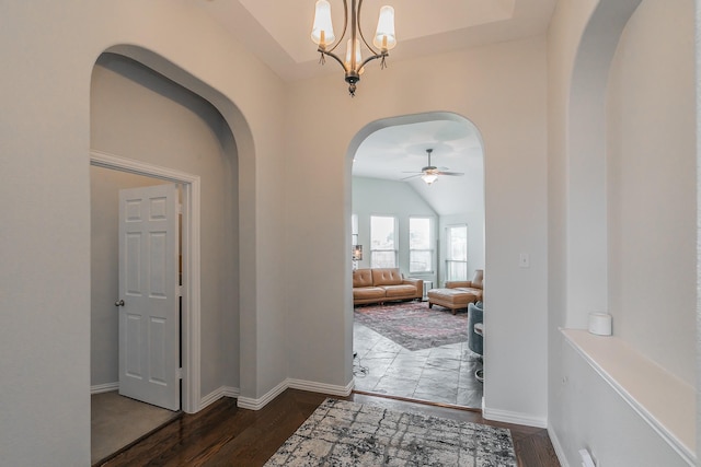 941 Sequoia Way, Saginaw, TX 76131 - foyer entrance featuring arched walkways, a ceiling fan, wood finished floors, a chandelier, and vaulted ceiling