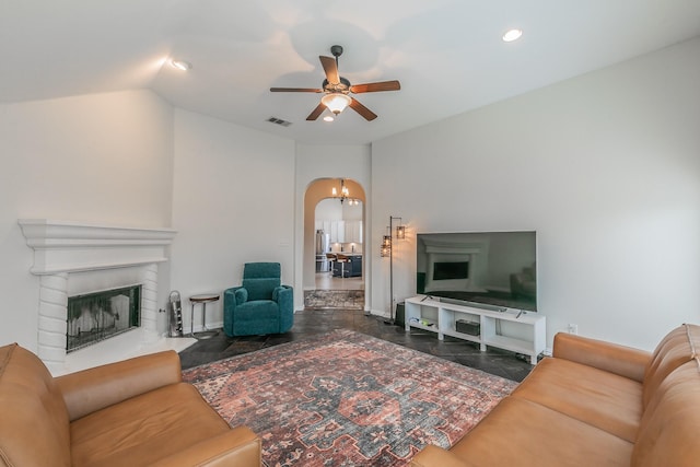 941 Sequoia Way, Saginaw, TX 76131 - living area with ceiling fan, arched walkways, a fireplace, recessed lighting, and lofted ceiling