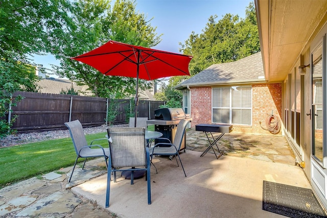 view of patio / terrace featuring outdoor dining area and grilling area