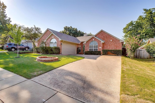ranch-style home featuring brick siding, an attached garage, driveway, and a chimney