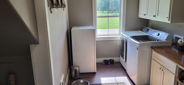 413 Prairie Crk, Sulphur Springs, TX 75482 - washroom featuring cabinet space, washer and clothes dryer, wood finished floors, and baseboards