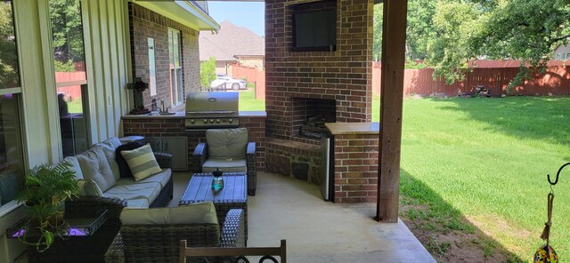 413 Prairie Crk, Sulphur Springs, TX 75482 - view of patio featuring area for grilling, an outdoor living space with a fireplace, and a sink