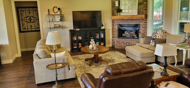 413 Prairie Crk, Sulphur Springs, TX 75482 - living area with baseboards, wood finished floors, and a fireplace