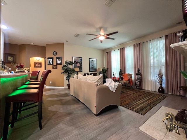 6869 Cape Cod Dr, Grand Prairie, TX 75054 - living area with a ceiling fan, light wood-type flooring, and baseboards