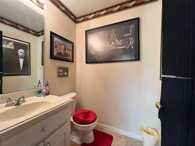 6869 Cape Cod Dr, Grand Prairie, TX 75054 - bathroom with baseboards, vanity, and toilet