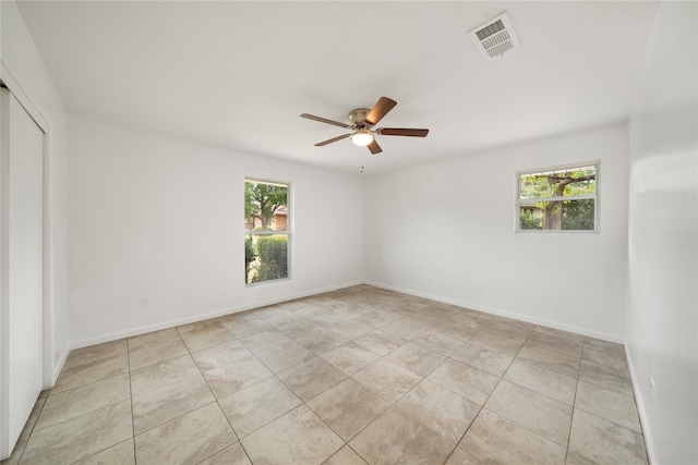 3707 Kimball Ridge Ct, Dallas, TX 75233 - unfurnished room featuring healthy amount of natural light, a ceiling fan, and light tile patterned floors