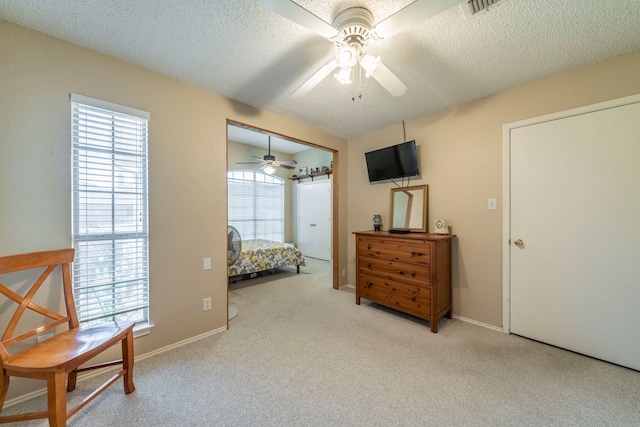5704 Poole Dr, The Colony, TX 75056 - bedroom with carpet floors, a textured ceiling, a ceiling fan, and baseboards