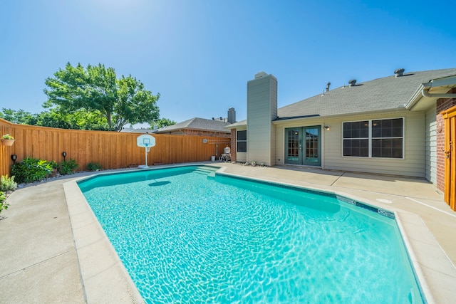 5704 Poole Dr, The Colony, TX 75056 - view of pool featuring french doors, a patio area, and a fenced backyard