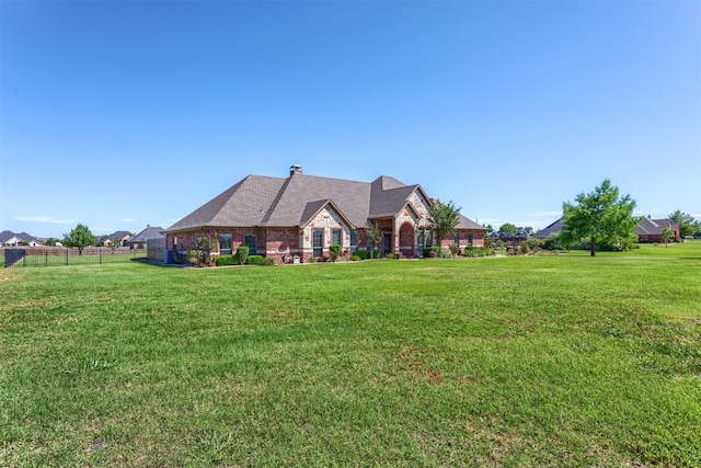 1777 Lone Star Blvd, Terrell, TX 75160 - french provincial home featuring stone siding, a chimney, and brick siding