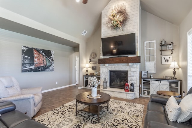 1777 Lone Star Blvd, Terrell, TX 75160 - living area featuring wood finished floors, a fireplace, baseboards, and high vaulted ceiling