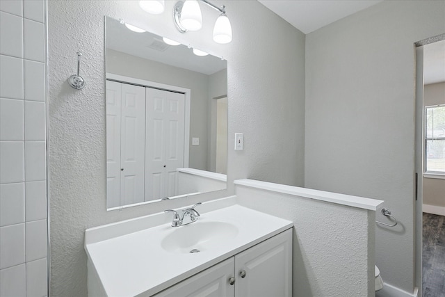 821 Collin Dr, Euless, TX 76039 - bathroom with vanity and a textured wall