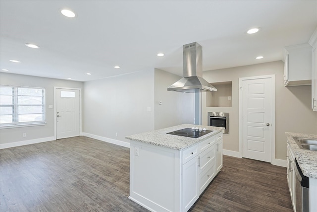 821 Collin Dr, Euless, TX 76039 - kitchen with appliances with stainless steel finishes, island exhaust hood, dark wood-style flooring, white cabinetry, and a center island