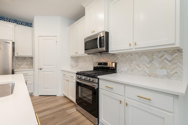 913 Emerling Dr, Mckinney, TX 75069 - kitchen with appliances with stainless steel finishes, light countertops, and white cabinetry