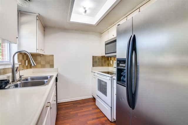 1826 Mercury Dr, Garland, TX 75040 - kitchen with appliances with stainless steel finishes, a sink, light countertops, and dark wood-style flooring