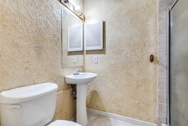 1826 Mercury Dr, Garland, TX 75040 - bathroom with toilet, an enclosed shower, baseboards, and tile patterned floors